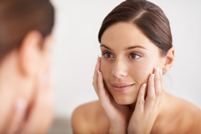 woman looks at her cheek volume