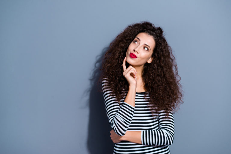 Portrait of her she nice-looking cute glamorous attractive lovely winsome dreamy wavy-haired lady looking aside up touching chin isolated over gray pastel background